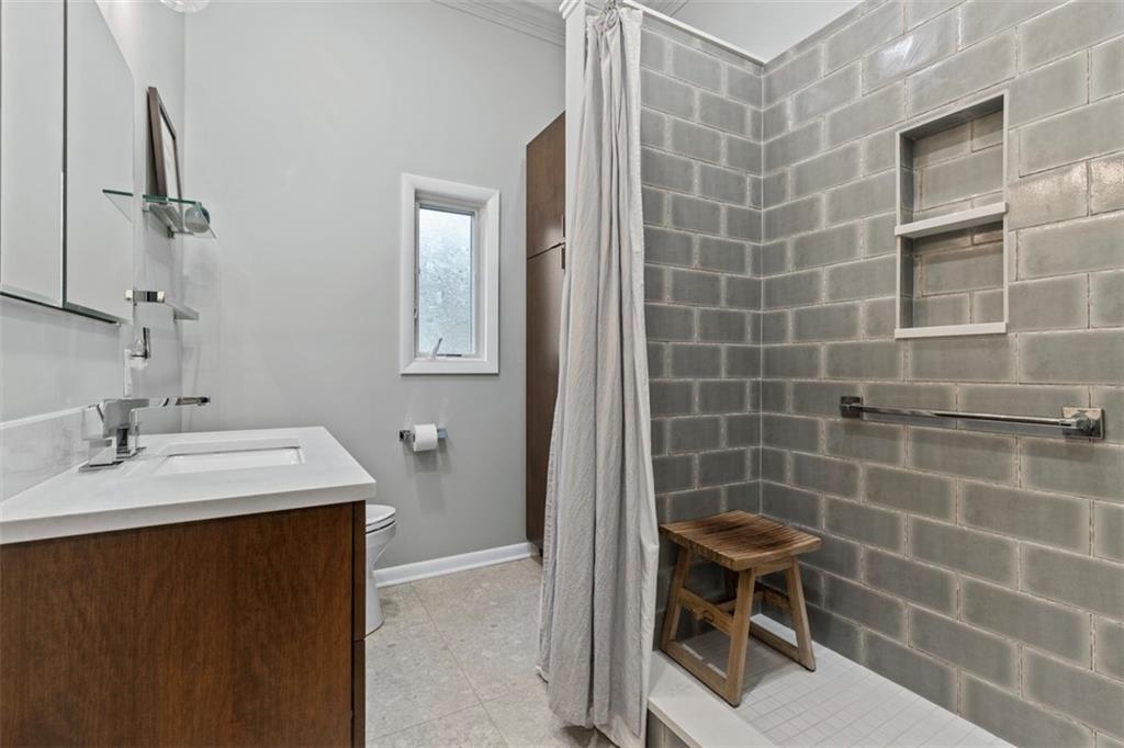 85 Lambeth Drive Pittsburgh, PA 15241 - Photo 28 of 47 a bathroom with a sink a toilet and mirror