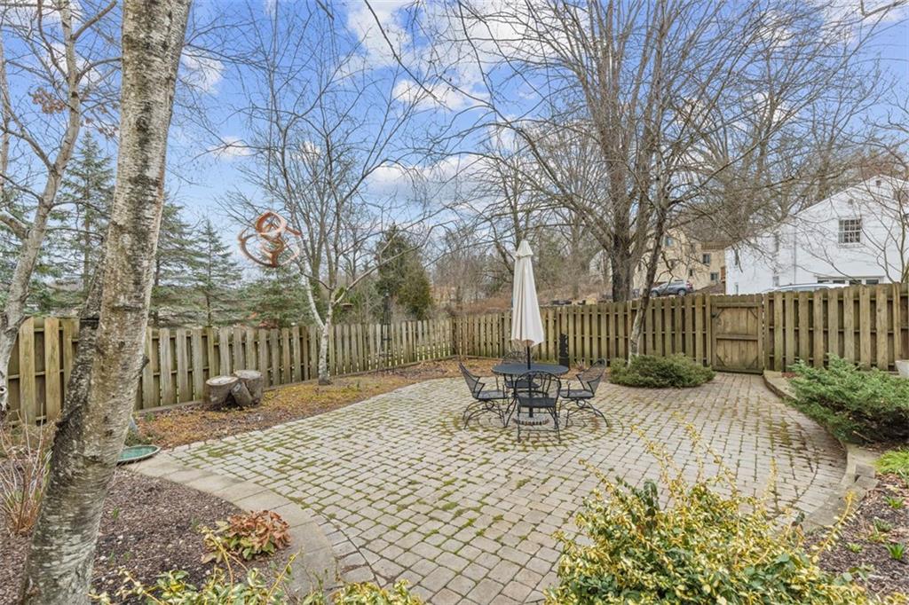 85 Lambeth Drive Pittsburgh, PA 15241 - Photo 38 of 47 a garden with a bench in the middle