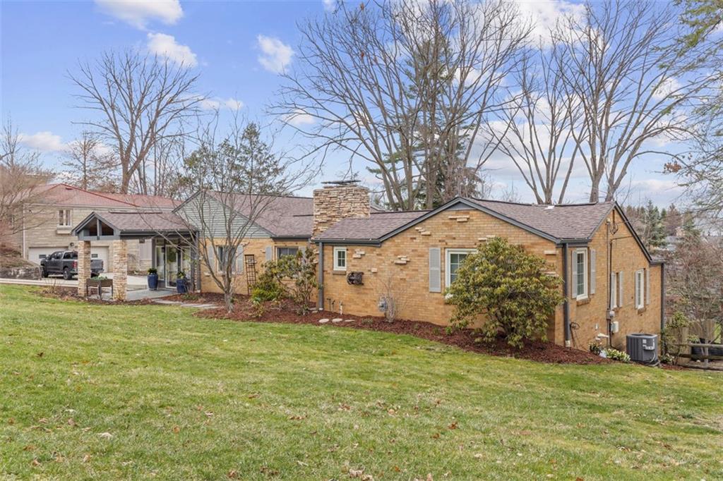 85 Lambeth Drive Pittsburgh, PA 15241 - Photo 4 of 47 a view of a house with a big yard and large trees