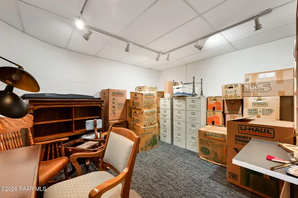 a view of a house with a yard and sitting space