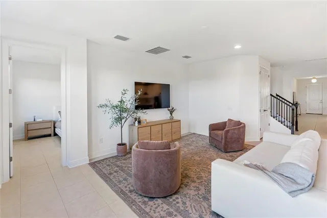 a spacious bathroom with a double vanity sink a mirror and a shower