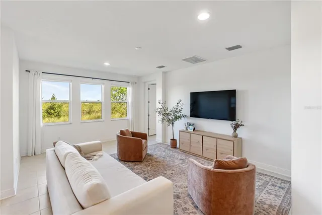 a view of a dining room with furniture window and outside view