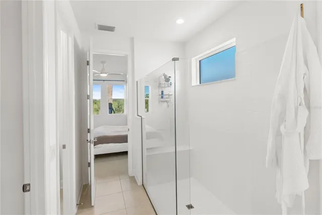 a bed room with a bed and a window