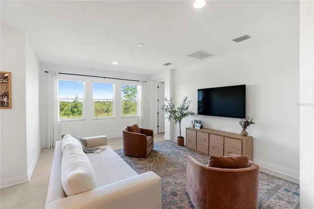 an aerial view of a house with a lake view