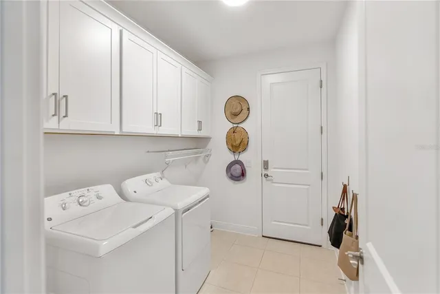 a front view of a house with a garden and parking