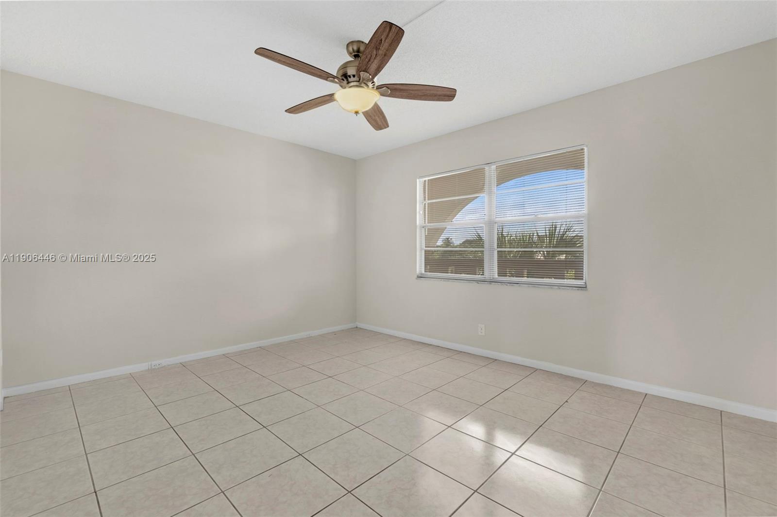 4401 Martinique Court, Unit C4 Coconut Creek, FL 33066 - Photo 22 of 26 a view of an empty room with a window