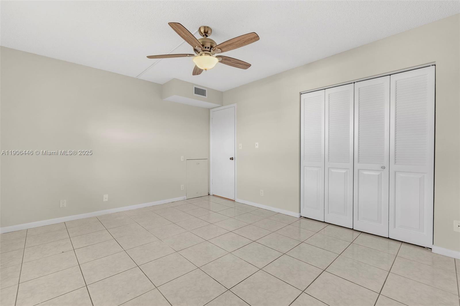 4401 Martinique Court, Unit C4 Coconut Creek, FL 33066 - Photo 23 of 26 wooden floor in an empty room