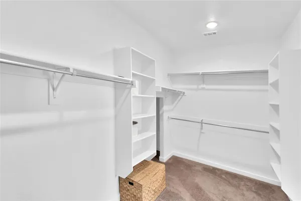 a view of an empty walk in closet