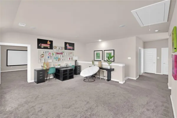 a living room with furniture and a lamp