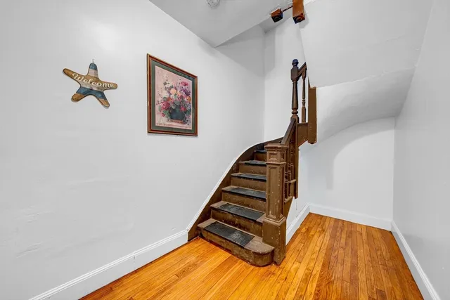 a view of staircase with white walls