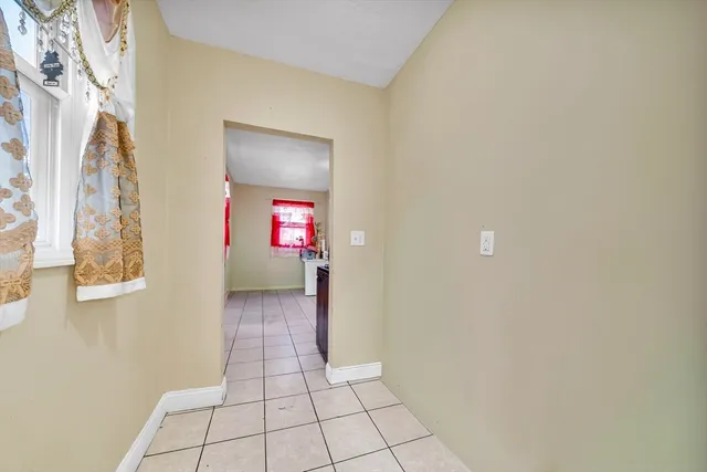 a view of a hallway view with wooden floor and staircase