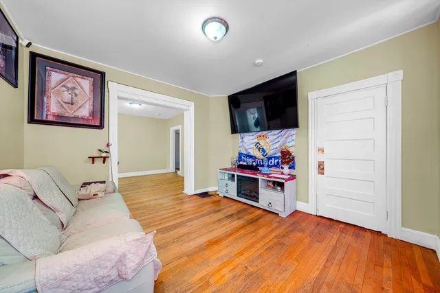 a bed room with a bed and a television