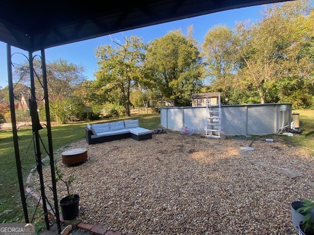 311 East 4th Street West Point, GA 31833 - Photo 20 of 32 a backyard of a house with lots of green space
