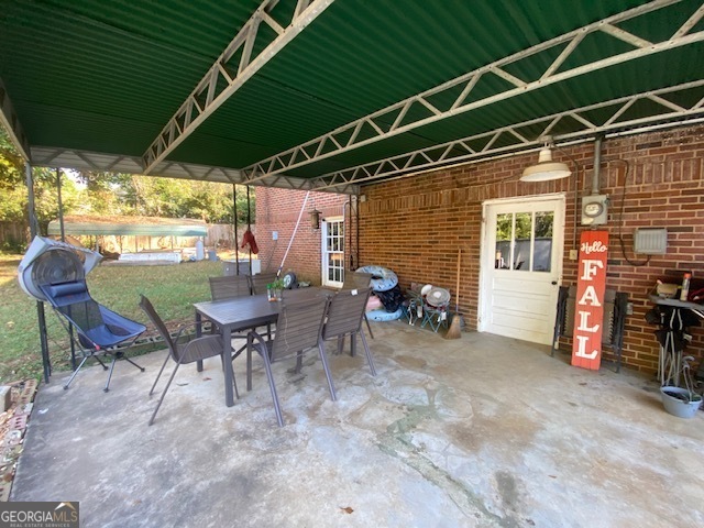 311 East 4th Street West Point, GA 31833 - Photo 21 of 32 a view of a chairs and table in patio