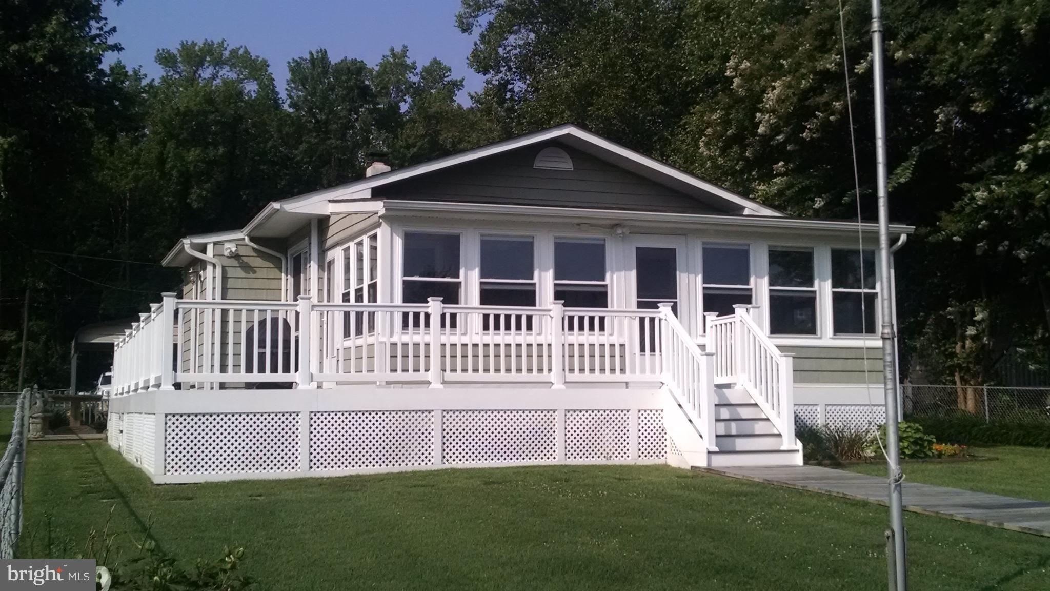 1229 Seneca Road Baltimore, MD 21220 - Photo 2 of 23 a front view of a house with a yard