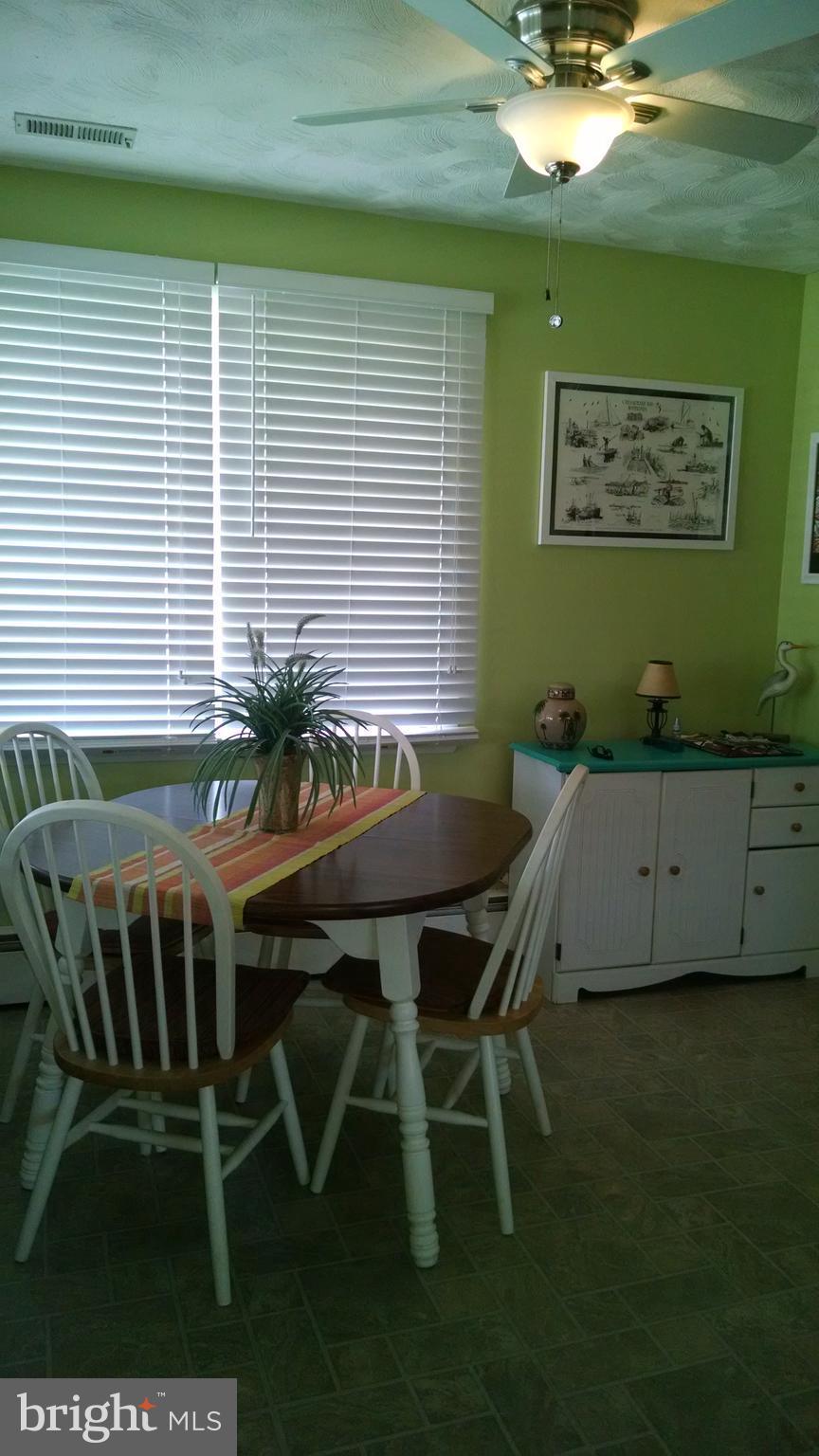 1229 Seneca Road Baltimore, MD 21220 - Photo 15 of 23 a balcony with table and chairs