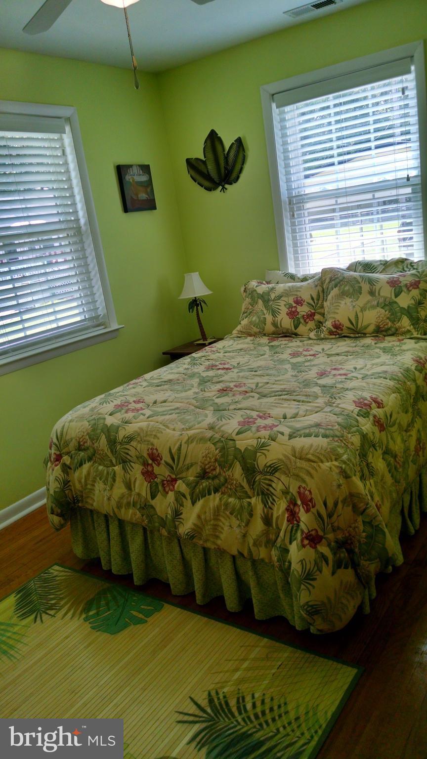 1229 Seneca Road Baltimore, MD 21220 - Photo 18 of 23 a bed sitting in a bedroom next to a window