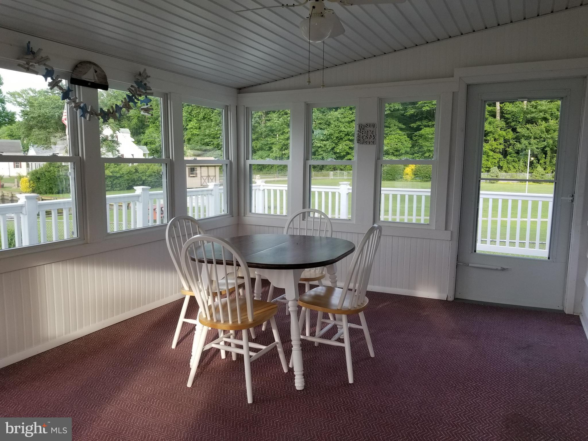 1229 Seneca Road Baltimore, MD 21220 - Photo 8 of 23 a view of a dining room with furniture window and outside view