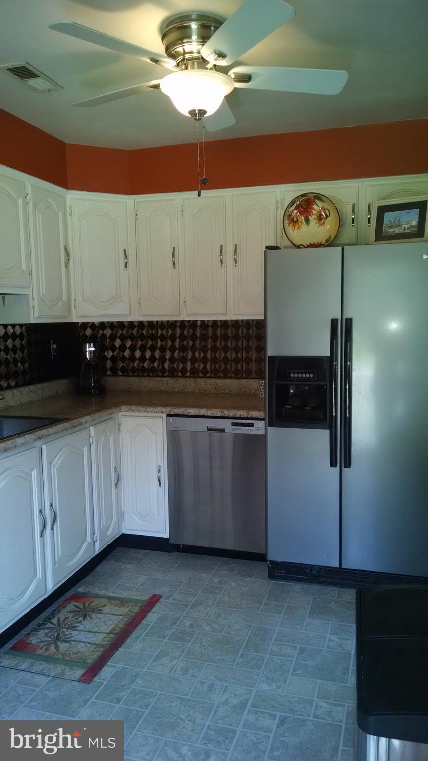 1229 Seneca Road Baltimore, MD 21220 - Photo 10 of 23 a kitchen with a stove and cabinets