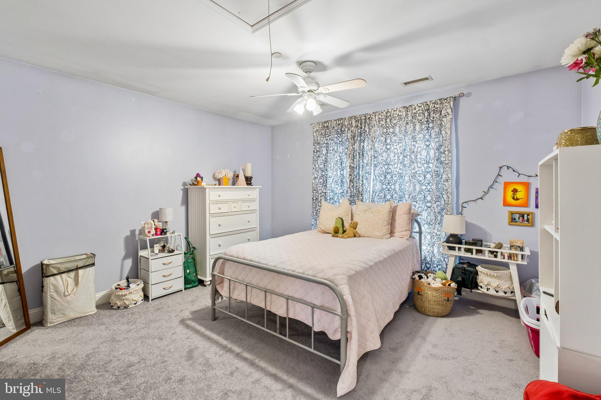 305 Langford Road Broomall, PA 19008 - Photo 53 of 83 a bedroom with a bed and a chandelier
