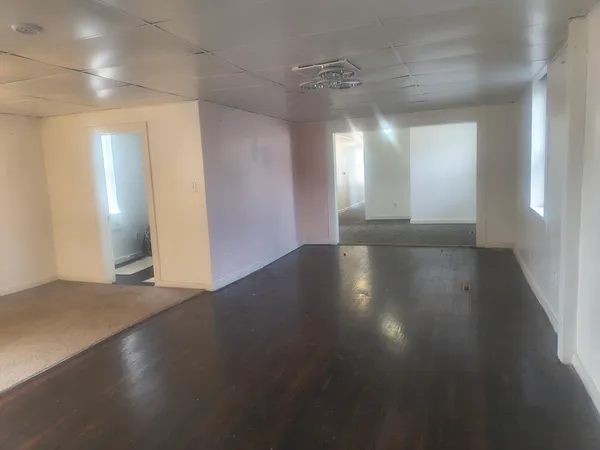 a view of room with window and pillar in it