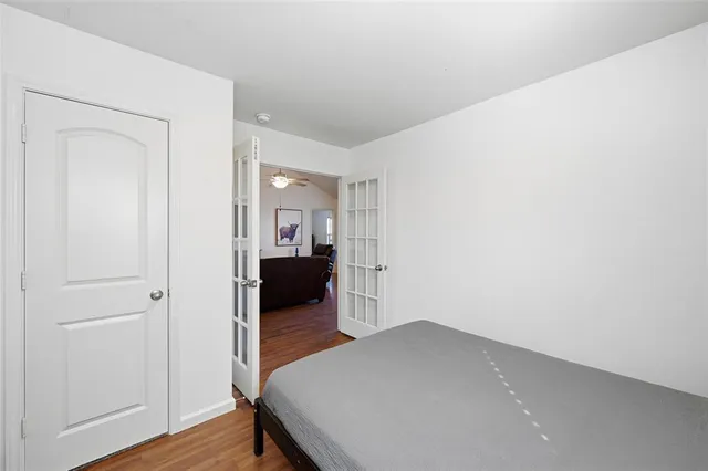 a view of a room with wooden floor