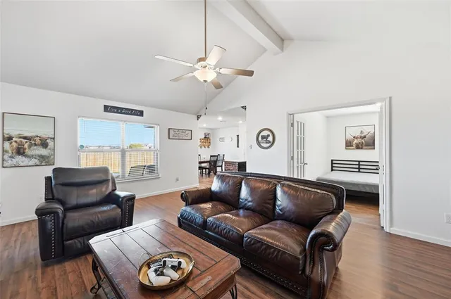 a living room with furniture and a window