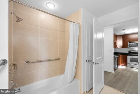 a bathroom with a shower and a tub