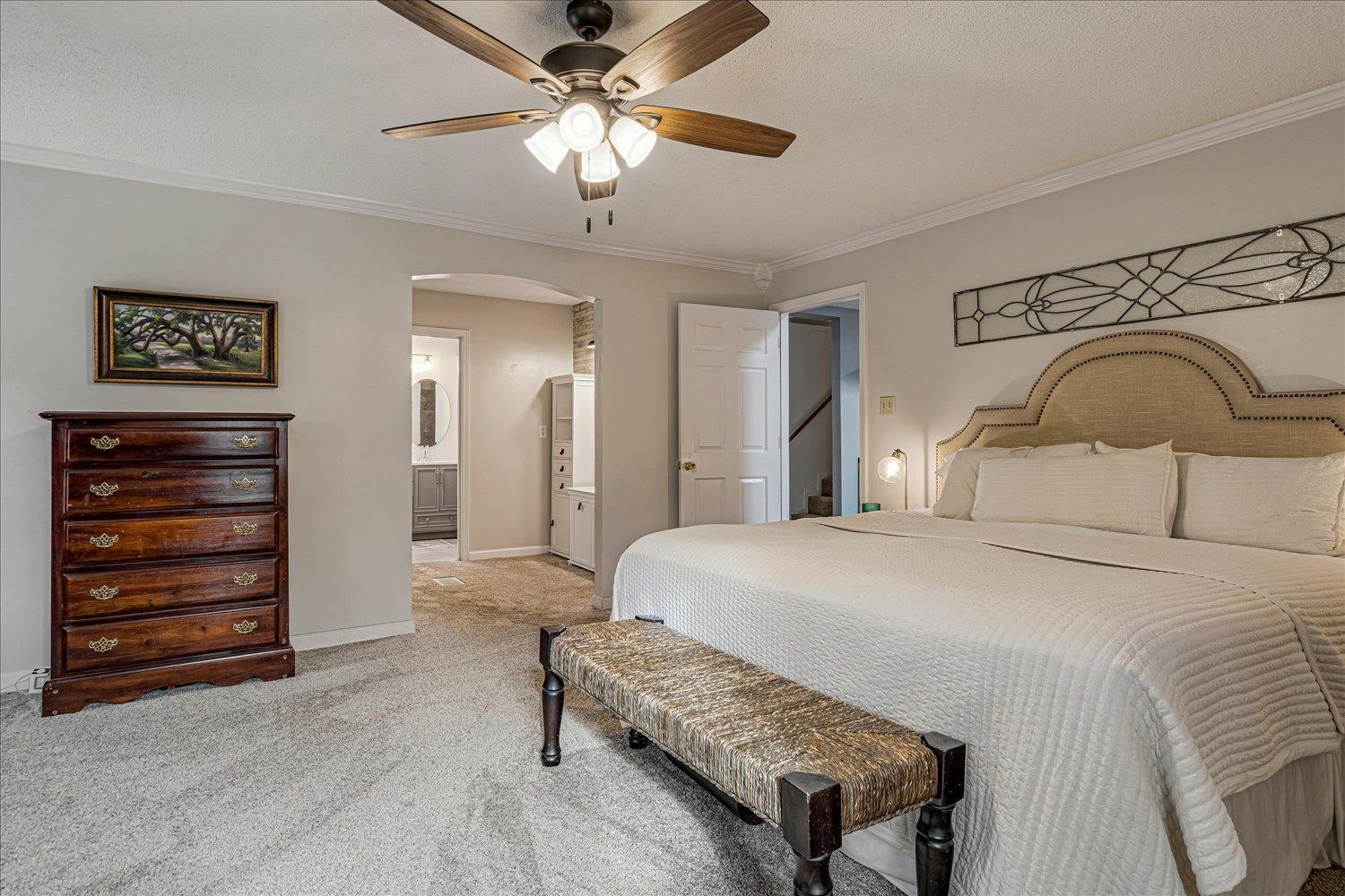 8379 Craven Road Bartlett, TN 38002 - Photo 16 of 40 a bedroom with a bed and a chandelier