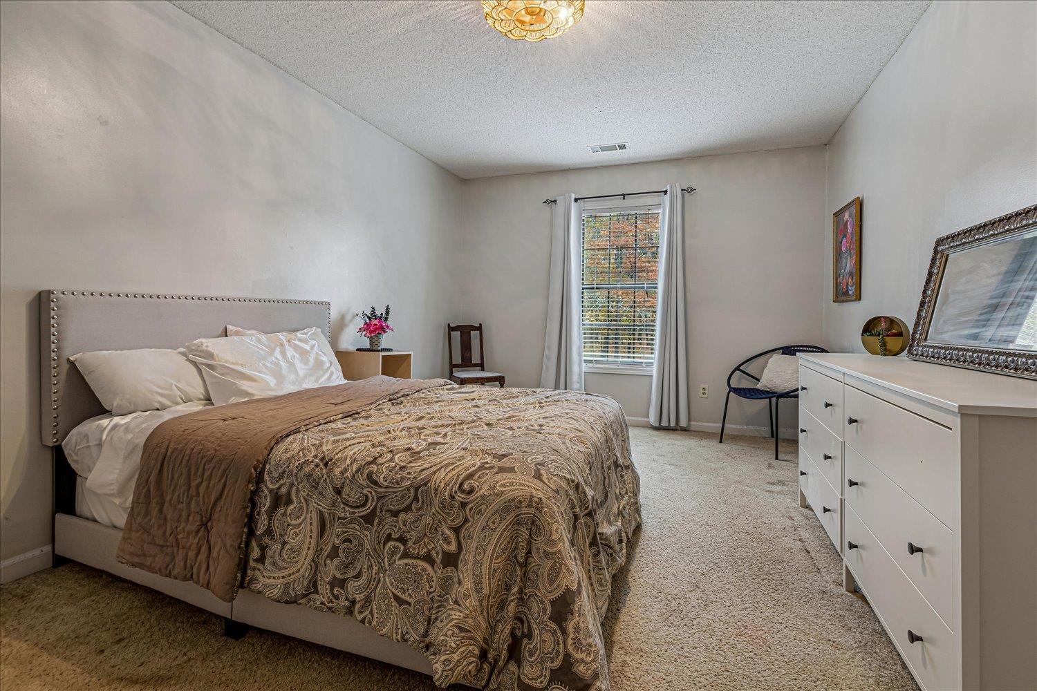 8379 Craven Road Bartlett, TN 38002 - Photo 23 of 40 a spacious bedroom with a bed and window