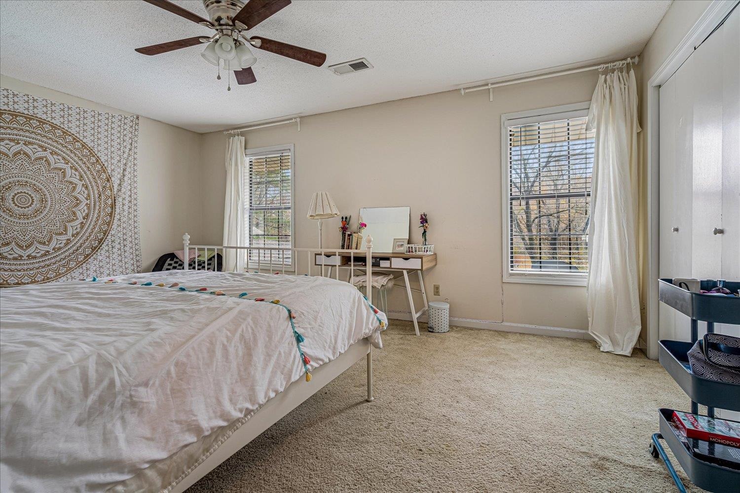 8379 Craven Road Bartlett, TN 38002 - Photo 24 of 40 a bedroom with a bed a table and chair