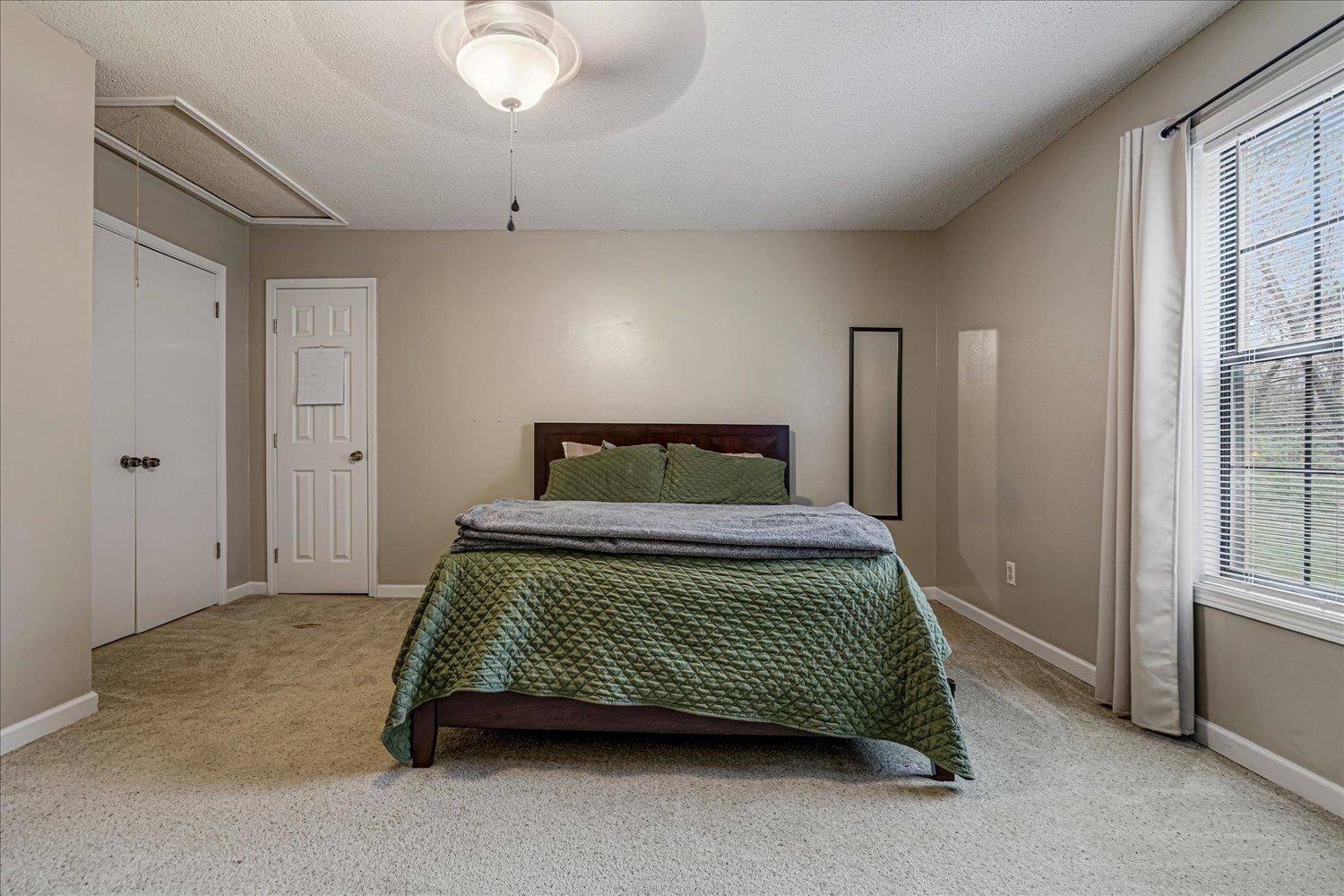 8379 Craven Road Bartlett, TN 38002 - Photo 27 of 40 a bedroom with a bed and window