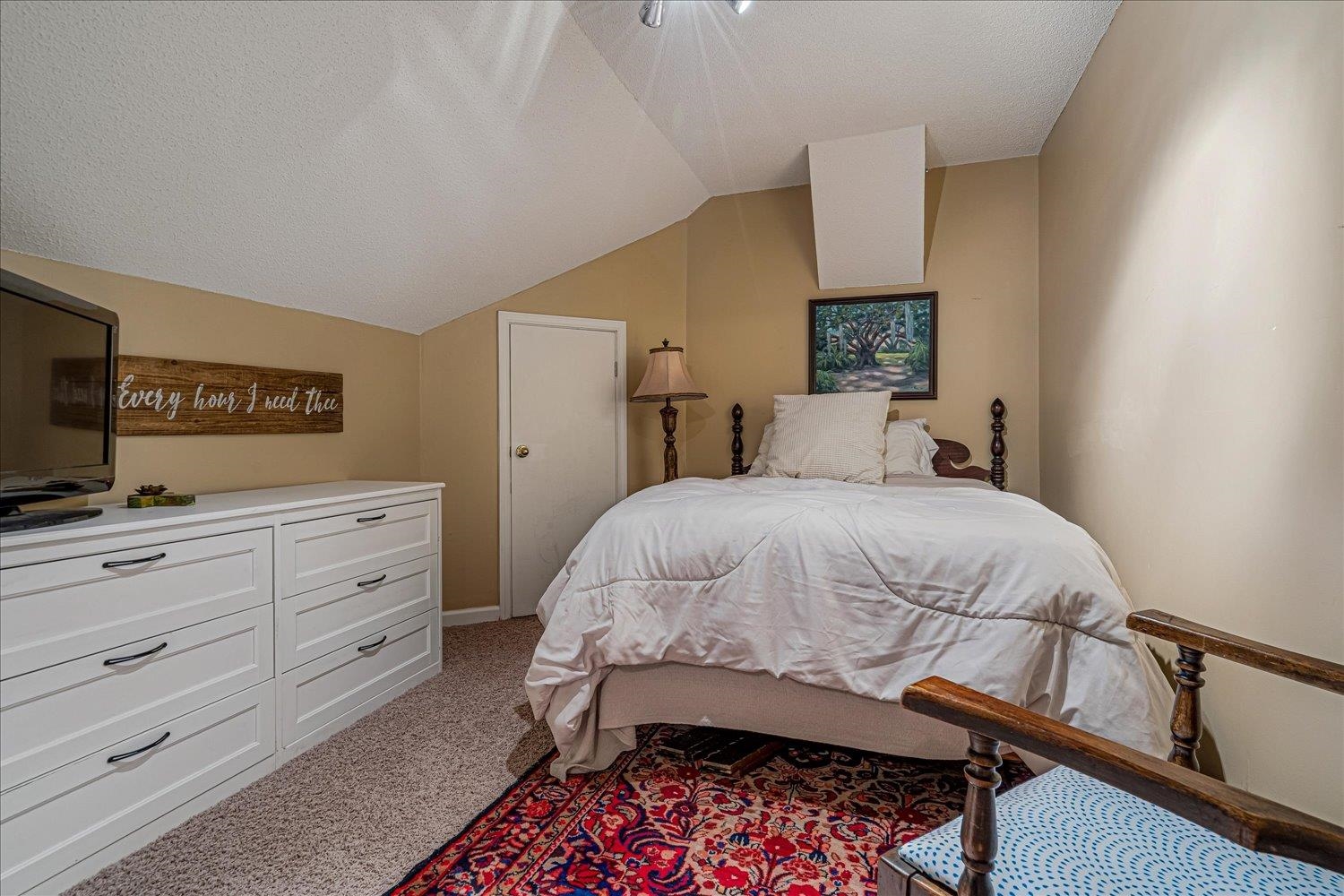 8379 Craven Road Bartlett, TN 38002 - Photo 30 of 40 a bedroom with a bed and a flat screen tv