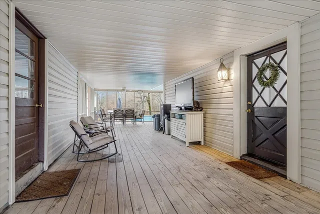 a view of a livingroom with furniture and hardwood floor