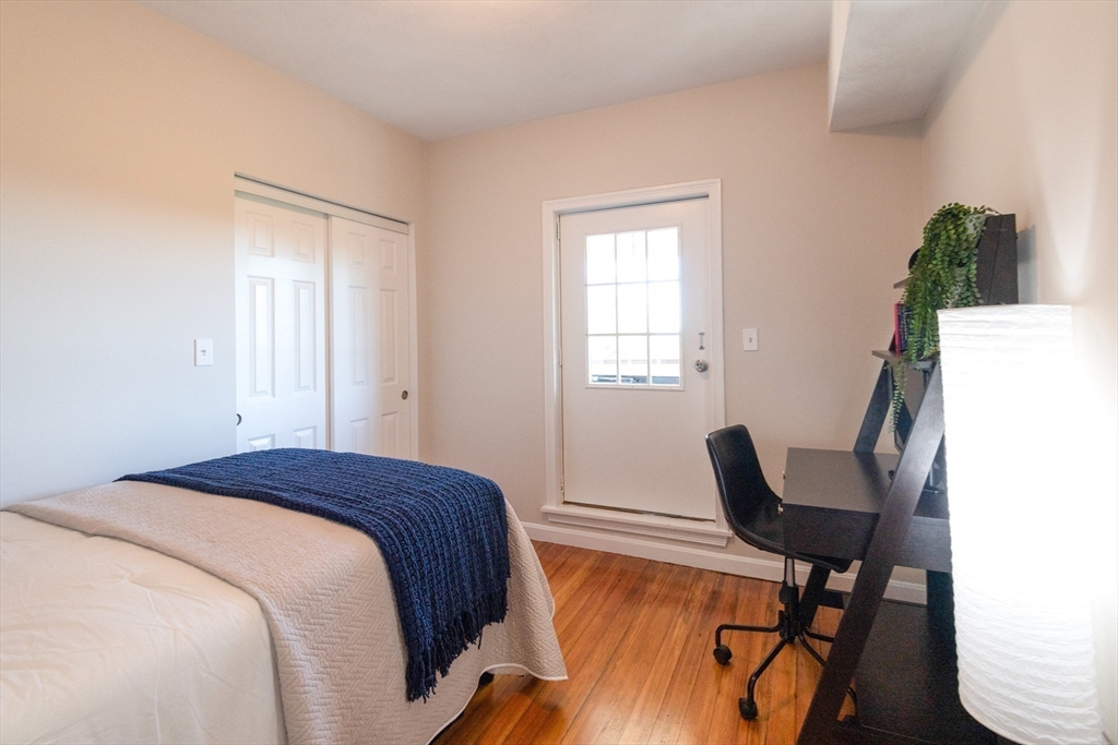 407 Washington Street, Unit 5 Boston, MA 02124 - Photo 12 of 24 a bedroom with a bed and a window
