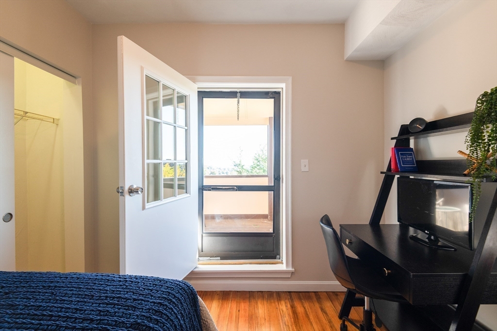 407 Washington Street, Unit 5 Boston, MA 02124 - Photo 14 of 24 a bedroom with a bed and a window