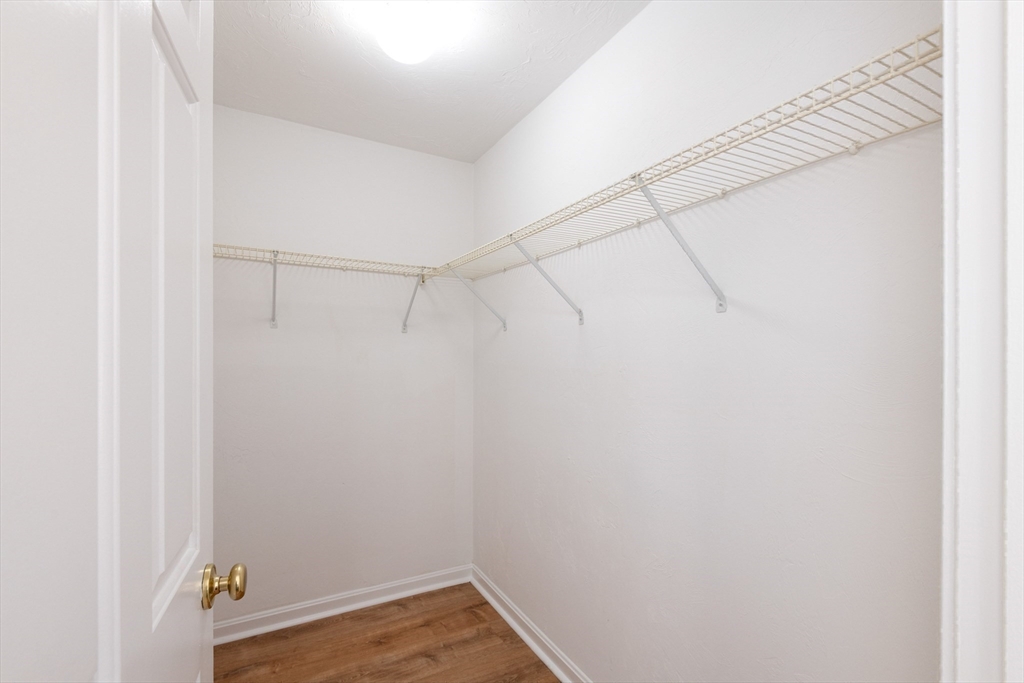 407 Washington Street, Unit 5 Boston, MA 02124 - Photo 20 of 24 a view of a room with racks on the wall