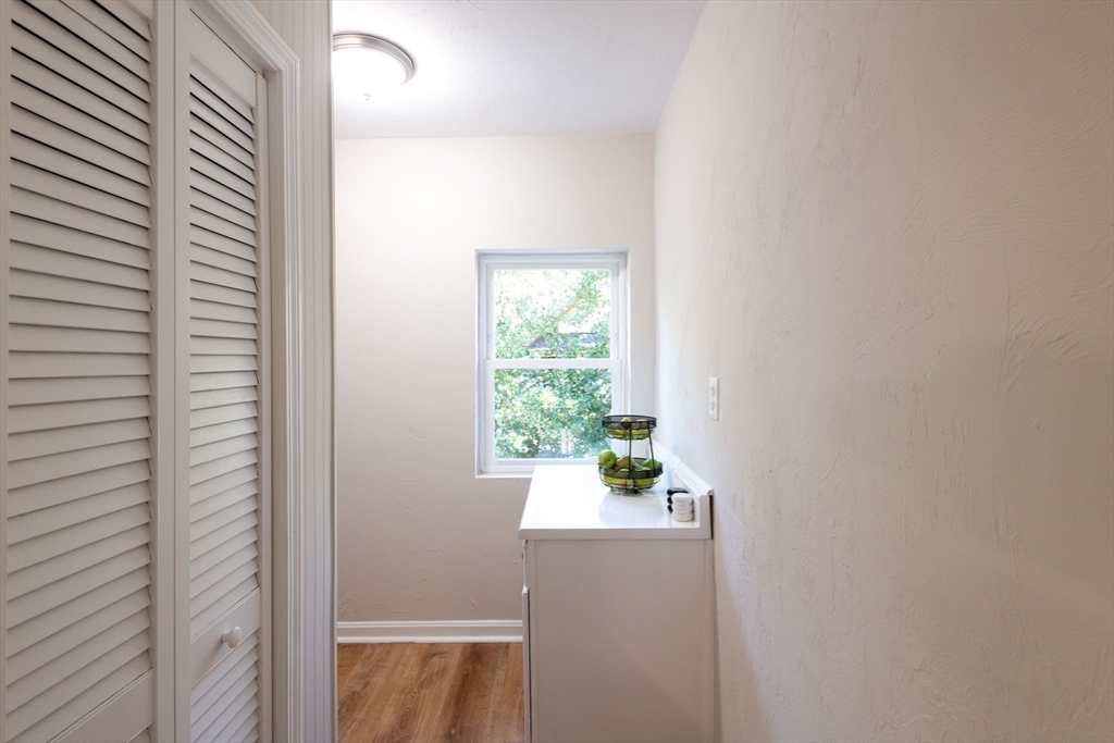 407 Washington Street, Unit 5 Boston, MA 02124 - Photo 21 of 24 a room that has a window in it