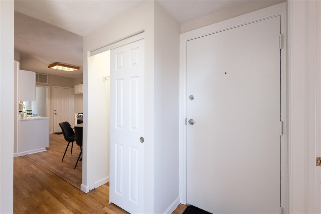 407 Washington Street, Unit 5 Boston, MA 02124 - Photo 23 of 24 a view of a livingroom and a bathroom