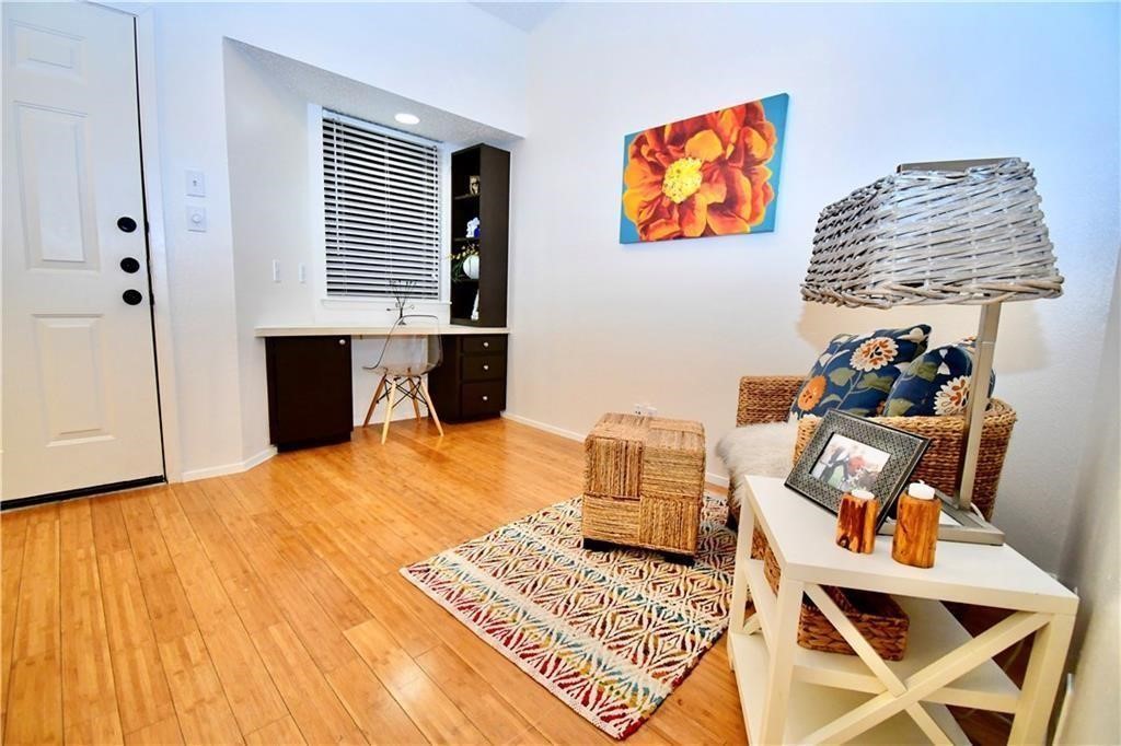 3316 Guadalupe Street, Unit 320 Austin, TX 78705 - Photo 1 of 1 a bedroom with a bed and wooden floor