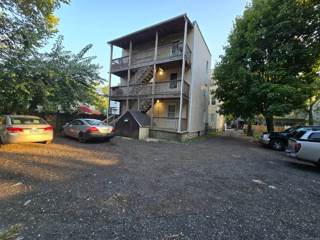 a view of car parked in front of house