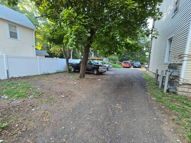 a view of a tree in front of a house