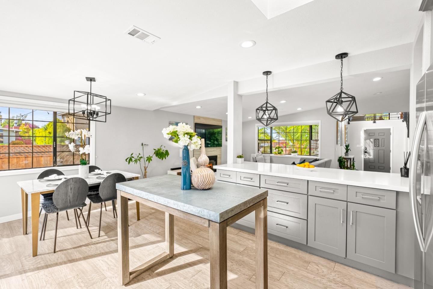 1776 Rex Street San Mateo, CA 94403 - Photo 11 of 46 a kitchen with a table chairs and white cabinets