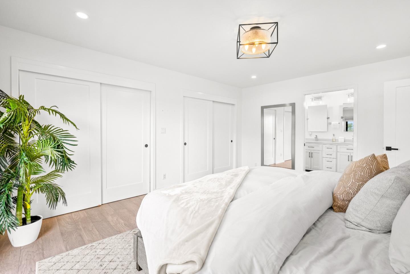 1776 Rex Street San Mateo, CA 94403 - Photo 42 of 46 a spacious bedroom with a bed and a potted plant