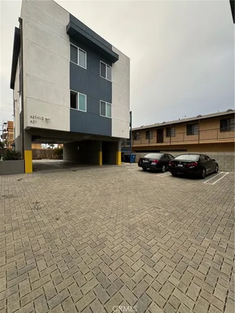 a view of a car park in front of house