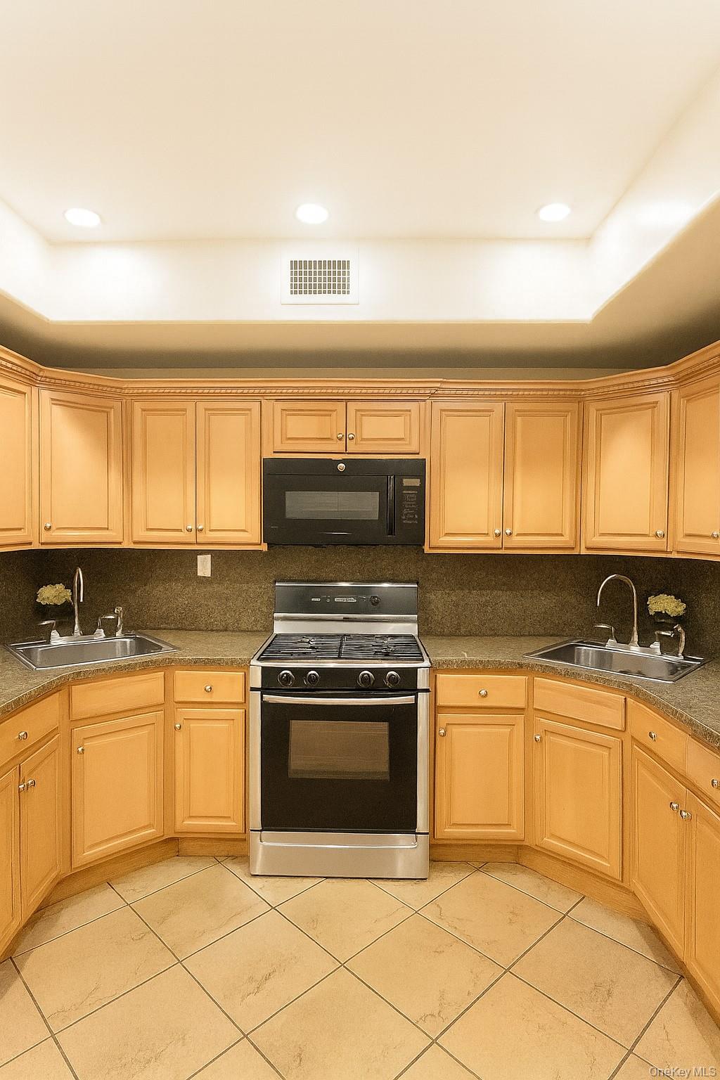 109 Rutledge Street, Unit 7 Brooklyn, NY 11249 - Photo 2 of 9 a kitchen with a stove top oven sink and cabinets