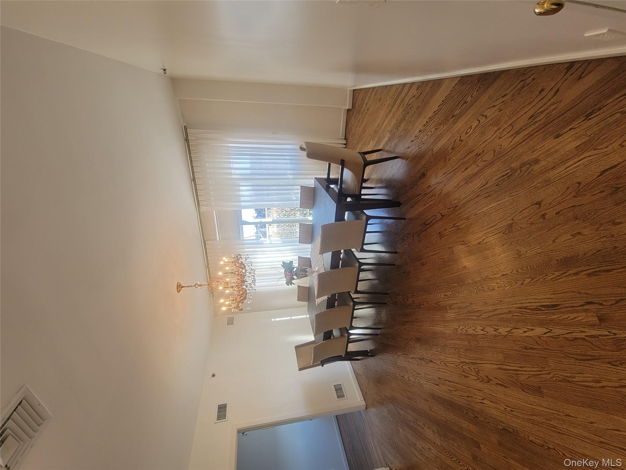 109 Rutledge Street, Unit 7 Brooklyn, NY 11249 - Photo 3 of 9 a view of a dining room with furniture window and wooden floor