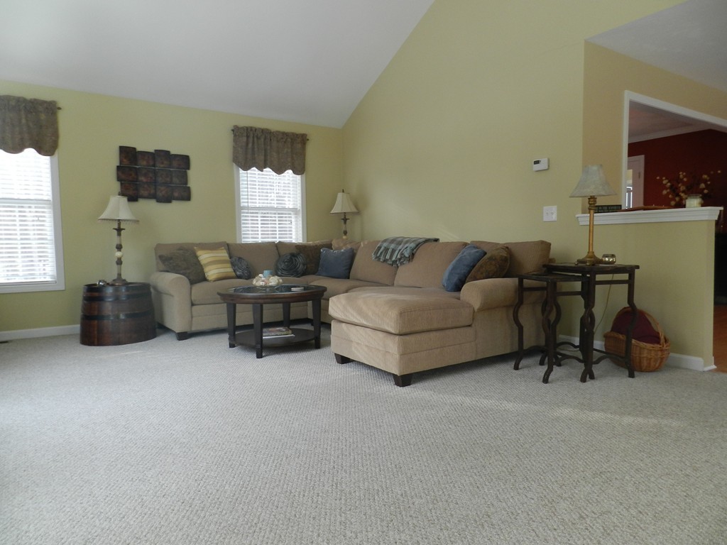 415 Mashapaug Road Holland, MA 01521 - Photo 4 of 26 a living room with furniture and a window