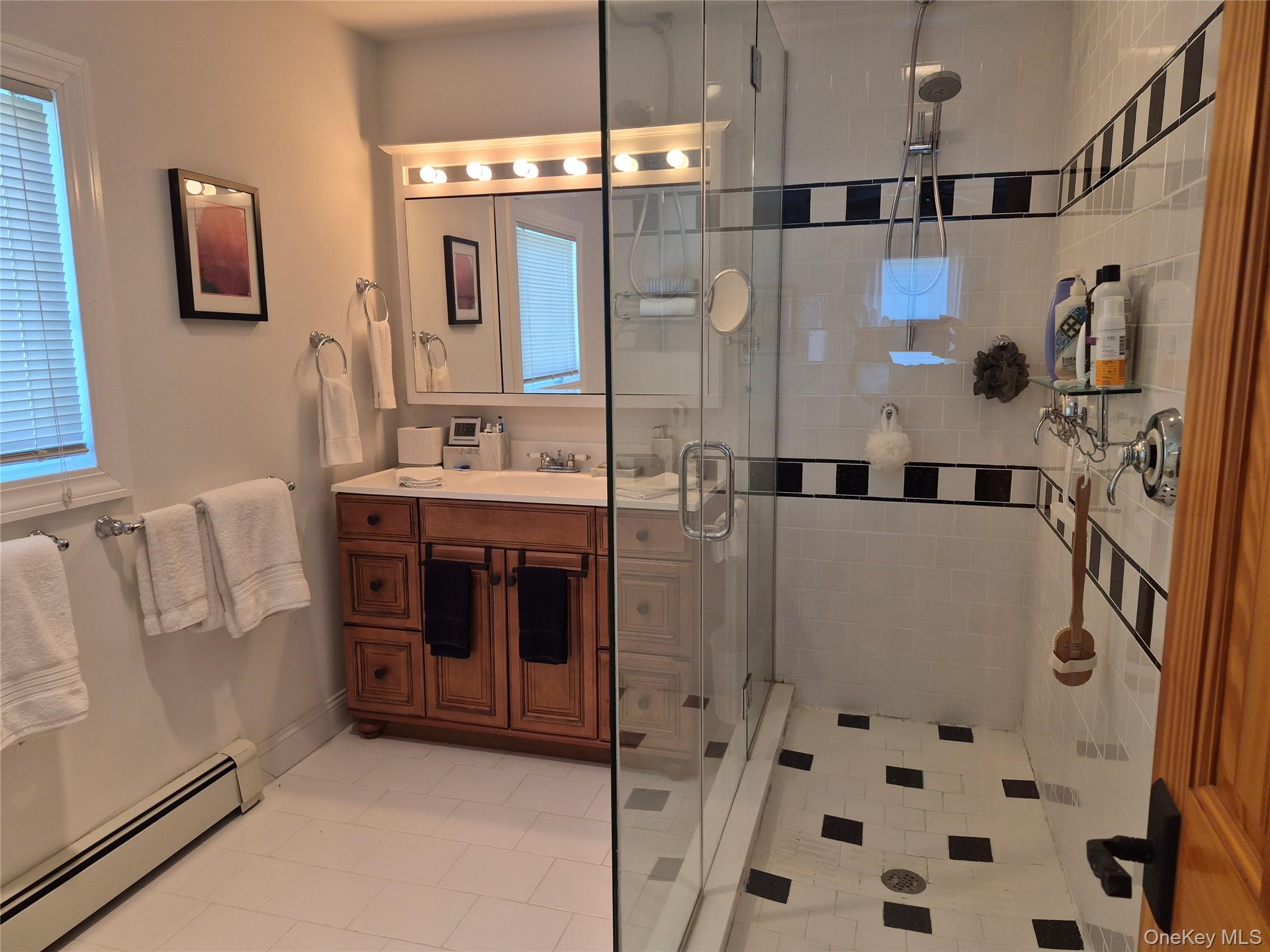 2 South Valley Road Hampton Bays, NY 11946 - Photo 11 of 19 a bathroom with a bathtub and a shower