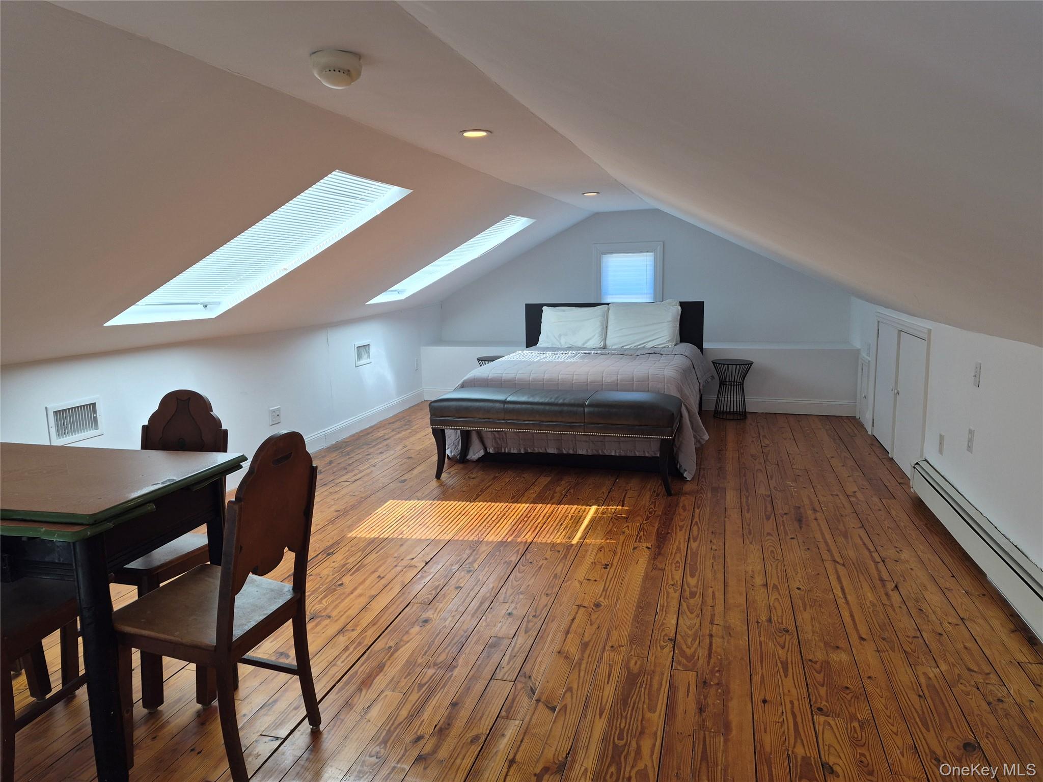 2 South Valley Road Hampton Bays, NY 11946 - Photo 12 of 19 a living room with furniture and a wooden floor